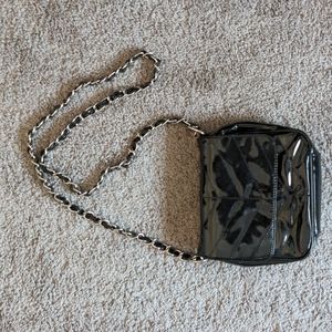 Black patent chain purse. Magnetic closure.